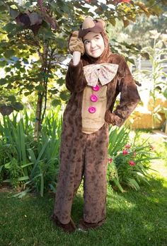 a man dressed in a monkey costume posing for the camera