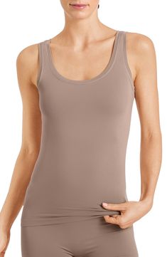 This seamless tank cut from buttery-soft microfiber comfortably stays in place and is perfect for layering. Style Name:Hanro Touch Feeling Tank. Style Number: 174618. Scoop Neck Tank Top With Minimal Stretch, Seamless Scoop Neck Tank Top With Medium Support, Seamless Medium Support Scoop Neck Tank Top, Stretch Seamless Camisole For Everyday, Compressive Seamless Tank Top With Wide Straps, Compressive Seamless Cami Tank Top, Solid Tank Top With Seamless Construction And Scoop Back, Solid Tank Top With Seamless Construction And Wide Straps, Solid Scoop Neck Smoothing Tank Top