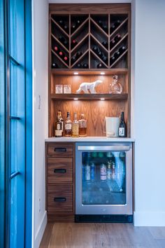 a wine rack in the corner of a kitchen