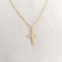 Simple Gold Filled Cross Necklace, First Communion Necklace, Baby Baptism Necklace, Confirmation Necklace, Everyday Necklace, Mom NecklaceAvailable in 14K Gold Filled ONLY.Specification. All component is 14K Gold Filled NOT plated. Cross size 10.2 x 16.4mm. Comes in a satin pouch. Length includes jump ring and claspIMPORTANT:Usually jewellery in the pictures looks bigger than in reality.Please consider all given dimension and compare them to the ruler before ordering.More collections of Religiou Yellow Gold Cross Necklaces For Baptism, Dainty Adjustable Jewelry For Baptism, Dainty Hypoallergenic Jewelry For First Communion, Gold Cross Pendant Jewelry For Baptism, Gold Cross Jewelry For Baptism, Spiritual Cross Pendant Jewelry For First Communion, Gold Cross Pendant Necklace For First Communion, Silver Dainty Jewelry For Baptism, Dainty Silver Jewelry For Baptism