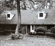 an old black and white photo of a house