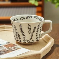 a coffee cup sitting on top of a tray