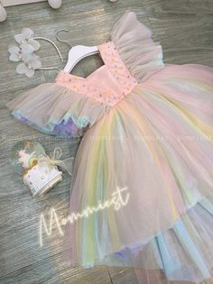 "** Please let a note about your current baby girl age/weight/height in checkout/inbox to help us prepare your order better ! Unique, outstanding and beautiful high low tulle baby girl dress made by Mommiest on theme: \"candy rainbow wonderland\" This dress is perfect for any special occasions such as wedding, birthday, first 1st birthday, party, photoshoots,... Material: tulle, satin, pearls Washing care: Handwash at 20 oC max; Wool spin mode; Iron at 100oC max *This design dress will be handma Whimsical Rainbow Princess Dress For Dress-up, Cute Multicolor Princess Dress For First Birthday, Cute Rainbow Princess Dress For Summer, Multicolor Ruffled Princess Dress For First Birthday, Multicolor Princess Dress With Ruffles For Birthday, Cute Multicolor Dresses For Wedding, Rainbow Princess Dress For Birthday, Cute Multicolor Dress For First Birthday, Multicolor Ruffled Tutu Dress For Wedding