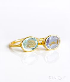 "You'll love this pairing of TWO oval gemstones rings: Alexandrite and Sky Blue Quartz. The pale lavender and light aqua blue of these pair of gemstones are a great combination. These happen to be the birthstones for June and December as well! Available in bright sterling silver or 18k vermeil gold. Gemstone are approximately 8mm x 13mm in size. Open back setting. Band stamped with 925 on inside. METAL ✦ 18K VERMEIL GOLD ✦ 18K ROSE VERMEIL GOLD ✦ BRIGHT STERLING SILVER Ring will be shipped in Da Adjustable Oval Rings With Gemstone Accents, Oval Aquamarine Ring With Bezel Setting, Aquamarine Oval Birthstone Ring, Oval Aquamarine Birthstone Ring For Gift, Oval Aquamarine Birthstone Ring As Gift, Aquamarine Birthstone Ring, Oval, Blue Oval Stackable Rings For Anniversary, Oval Aquamarine Crystal Ring With Gemstone, Oval Large Stone Sapphire Ring Gift