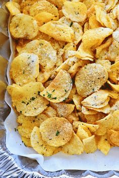 a tray filled with potato chips covered in seasoning