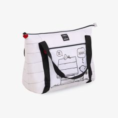 a white bag with a cartoon drawing on the front and side pocket, featuring a black handle