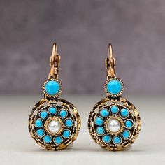 We loved our rose model imitation diamond earrings from the Ottoman period and enjoyed making them. We both brought back an element of our culture and that reminds us the past. We tried to create a diamond look with turquoise crystal stones in our Ottoman rose model imitation diamond bronze earrings. In our Anatolian culture, we used to see these earrings in our grandmothers at a young age, and they were handed down to our mother as a legacy from them and later to us. We are currently trying to Ornate Bronze Earrings, Elegant Turquoise Nickel-free Flower Earrings, Elegant Turquoise Flower Earrings Nickel Free, Antique Blue Earrings, Turquoise Brass Earrings, Vintage Turquoise Round Earrings, Rosé Model, Bronze Earrings, Turquoise Crystal