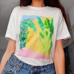 Sleepy girl white graphic t-shirt. Such a unique botanical print of a watercolour painting. Hand designed by an independent artist (me!) In the UK 🔥   💓 100% high quality sustainable organic cotton   💓 Printed with inks that contain no chemicals that are harmful to you or the environment. Toxin free.   💓 High quality print, not a cheap heat transfer    💓 So soft, made to last   💓 Can be worn tied or cropped    💓 SIZE M FITS 8/10/12: Around Chest: 38 inches. Length: 29 inches.  More sizes available! Let me know via message and I can make your size. Fast and free UK shipping. ✔ Wash at 30 degrees Celcius, inside out Do not tumble dry Do not iron over print More art prints, tote bags and tees available on my shop!  https://www.etsy.com/uk/shop/Marisaillustration White T-shirt With Artwork For Summer, White Relaxed Fit T-shirt With Watercolor Print, White Watercolor Print Short Sleeve T-shirt, Casual White T-shirt With Watercolor Print, Summer Botanical Screen Print T-shirt, Botanical Screen Print Summer T-shirt, Botanical Screen Print T-shirt For Summer, White Watercolor Print T-shirt For Spring, Artistic White Summer T-shirt