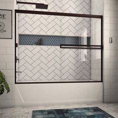 a bathroom with a rug and shower door