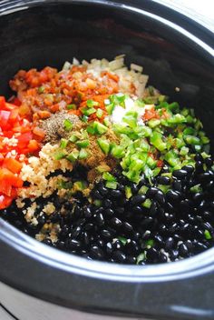 black beans, carrots, and other ingredients in a slow cooker to make an entree