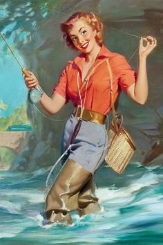 a woman in an orange shirt and blue skirt is holding a fishing rod while standing in the water