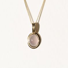 Less is more with this understated stunner. The pendant is made in 18k gold and comes on an 18” curb chain made in solid 14k gold. The chalcedony is made with a Nevada-mined chalcedony. It has a beautiful opaque lilac hue that really radiates against the yellow gold bezel. Fine Jewelry In Yellow Gold With Chalcedony, Minimalist 14k Gold Oval Cabochon Jewelry, Elegant Chalcedony Oval Pendant Jewelry, Modern Chalcedony Jewelry With Polished Finish, Yellow Gold Chalcedony Gemstone Necklace, Elegant Rose Quartz Yellow Gold Jewelry, Minimalist Yellow Gold Cabochon Jewelry, Minimalist 14k Gold Jewelry With Cabochon, Elegant Yellow Gold Jewelry With Rose Quartz