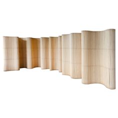 a room divider made out of bamboo sticks on a white background with no one in it