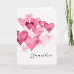 a valentine's day card with pink watercolor hearts and the words you're all heart