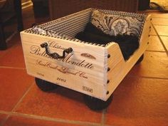 a wooden crate sitting on top of a tiled floor