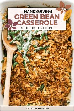 thanksgiving green bean casserole in a white dish with a wooden spoon on the side