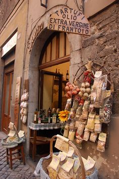 an old building with many items on display outside