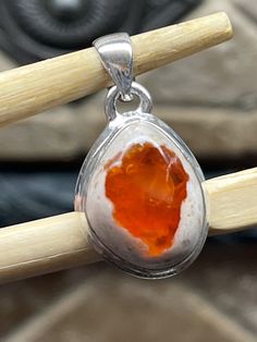 Handmade, natural product Stone: Genuine Mexican Fire Opal Metal: 925 Sterling Silver Gemstone size: 18mm X 15mm Orange Sterling Silver Jewelry With Gemstone, Sterling Silver Jewelry With Large Amber Stone, Sterling Silver Amber Jewelry With Large Stone, Silver Carnelian Teardrop Jewelry, Silver Teardrop Carnelian Jewelry, Orange Sterling Silver Jewelry With Natural Stones, Untreated Amber Jewelry Gift, Red Sterling Silver Jewelry With Large Stone, Untreated Red Sterling Silver Jewelry