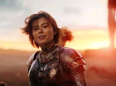 an image of a woman in armor looking off into the distance