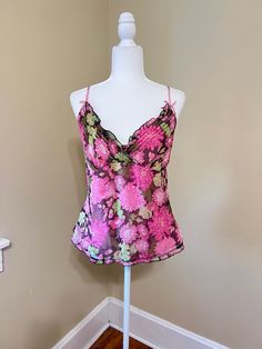 Vintage SILK Lilly Pulitzer Floral Camisole. Bright pink flowers with shades of green, brown. V neckline, narrow ruffled edge, stitching detail at bodice.  Adjustable straps, gathered skirt. L Side zip, back gather panel with loose stretch. All silk chiffon fabric with full silk lining. Size 8 average fit. Preowned, lightly worn, in nice vintage condition with no tears or stains found. Please check measurements below for accurate sizing. Bust 36-37" Underbust 33". Length from top to hem with str Multicolor Tank Camisole For Spring, Fitted Multicolor Camisole, Spring Multicolor Floral Print Camisole, Cheap Pink Y2k Camisole, Fitted Pink Floral Print Camisole, Fitted V-neck Tank Top With Floral Print, Pink Lace Trim Camisole Top, Green Floral Print Camisole Top, Pink Fitted Vintage Camisole