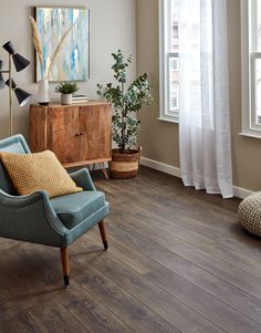 a living room with hardwood floors and furniture