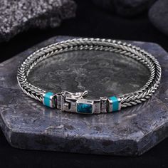 Wholesale Men's Bali Silver Jewelry with Turquoise gemstone This solid 925 sterling silver bracelet is handmade by silver artisans in Bali. This piece is guaranteed over 92.5% pure silver with silver plated for finishing to make them shine long last. Need a custom size? Let us know. Material: Silver 925 Width: 4 mm Gender: Men's bracelet, Women's Bracelet Length= 7 until 9 inch ( possible for custom size) Gemstone: Turquoise Technique: Handmade Occasion: Fathers Day gifts, anniversary, birthday Bali Silver Jewelry, Mens Sterling Silver Bracelets, Dragon Bones, Mens Silver Jewelry, Artisan Bracelets, Bali Silver, Mens Bracelet Silver, Labradorite Bracelet, Bracelet Men