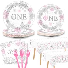 two plates, one with pink forks and the other with silver snowflakes