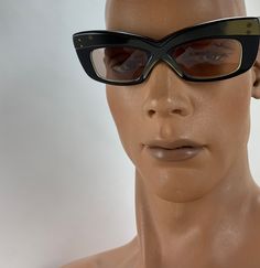 Vintage 1960'S Sci Fi Sunglasses in a sixties futuristic style, very thick cyber sci fi Frames.. these are Unisex, so both guys and gals can wear them.... These frames are so fun & funky! Kinda Mod, kinda Sci Fi... on the stem is printed: MADE IN FRANCE These were made as fashion sunglasses in the 1960's from France.. and are Used but in EXCELLENT VINTAGE CONDITION. There is gold coloring along the front of the frames, stronger color on the right side where the left side seems rather faded. Retro Sunglasses With Gradient Lenses For Evening, Retro Black Sunglasses For Formal Occasions, Retro Cat Eye Sunglasses With Mirrored Lenses For Party, Retro Black Sunglasses For Evening, Retro Evening Sunglasses With Gradient Lenses, Retro Cat Eye Sunglasses For Evening, Retro Cat Eye Sunglasses For Parties, Retro Glass Sunglasses For Parties, Retro Party Sunglasses With Glass Lenses