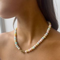 The Encirkled Candy Opal Necklace is the ultimate addition to your neck stack. This piece includes brightly colored rainbow gemstones featuring a 14k spring ring closure perfect for displaying your favorite charms. 8mm assorted Peruvian Opal Gemstones 12mm 14k yellow gold spring ring clasp Each piece is unique and may vary slightly It comes with a card listing the included gemstones Made in Westport, Connecticut