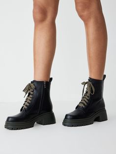 a woman wearing black combat boots High Ankle Combat Boots For Spring Workwear, Spring Workwear High Ankle Combat Boots, Casual Mid-calf Combat Boots For Fall, Casual Combat Boots For Workwear In Fall, Casual Combat Boots For Workwear And Fall, Casual Black Combat Boots For Fall, Casual Combat Boots For Spring Workwear, Casual Spring Combat Boots For Workwear, Textile Waste