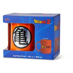 an orange coffee mug in a blue box with the word dragon'z on it