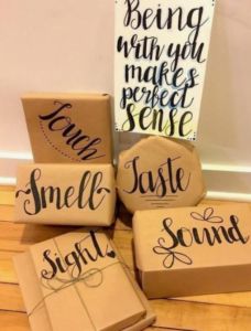 some brown boxes are sitting on the floor next to a sign that says smile sound