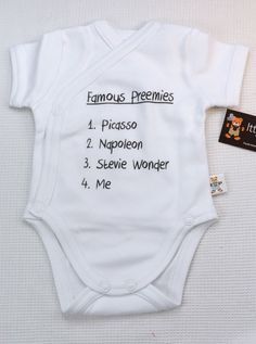 a white baby bodysuit with the names of its babies