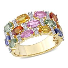 This vibrant  Multi-Color Sapphire Triple Row Ring is crafted in 14-karat yellow gold and features 13 oval-cut multi-color yellow, pink, blue, green and red sapphire gemstones with 28 round-cut white sapphire accents carefully set in a unique mosaic style three-row design. With exquisite colors and a brilliant shine, this ring is sure to make a standout addition to any jewelry collection. Formal Multicolor Round Sapphire Ring, Multicolor Sapphire Ring With Prong Setting, Multicolor Sapphire Ring For Formal Occasions, Formal Multicolor Oval Diamond Ring, Multicolor Oval Diamond Ring For Formal Occasions, Multicolor Oval Sapphire Ring, Formal Multicolor Sapphire Ring With Prong Setting, Multicolor Sapphire Ring With Prong Setting For Formal Occasions, Formal Multicolor Gemstone Rings