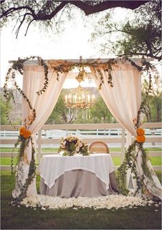 an outdoor table set up for a wedding