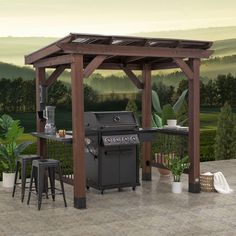 an outdoor bbq with grill and bar stools