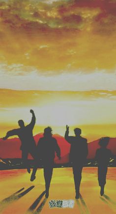 three people standing in front of a sunset with their arms up and one person on the ground