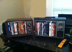 an old fashioned radio sitting on top of a desk next to a shelf with cds