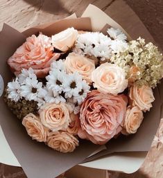 a bouquet of flowers sitting on top of a table