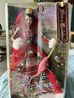 the queen of hearts barbie doll is in its package