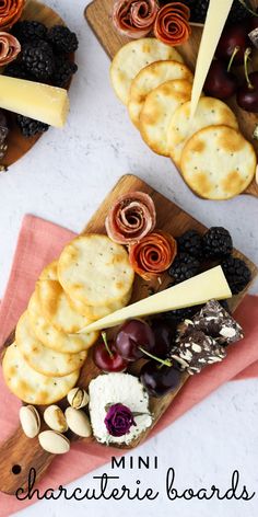 cheese, crackers and grapes are arranged on small wooden trays with text overlay that reads mini charcuterie boards