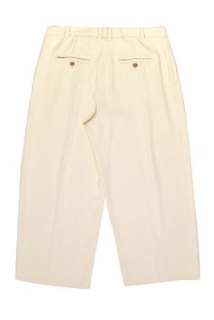 Rock the office (and happy hour) in these cream wide-leg dress pants from Vince, perfect for a modern minimalist. Style with a classic button-front blouse and loafers for a chic yet professional look. Perfect for those who like to mix business with pleasure! Size 10 55% Recycled Polyester, 45% Polyester Covered zipper with top button closure Pleated detail Two side slip pockets Two back button pockets Belt loop waist Waist 35" Hips 40" Length 36.5" Inseam 25.5" Chic Cream Bottoms With Pressed Crease, Tailored Cream Wide Leg Pants For Formal Occasions, Classic White Wide Leg Pants For Work, Chic Cream Wide Leg Pants For Formal Occasions, Classic Cream Wide Leg Pants For Work, Cream Pants With Pressed Crease For Work, Cream Wide Leg Dress Pants For Formal Occasions, Cream Formal Bottoms With Pressed Crease, Formal Cream Bottoms With Pressed Crease