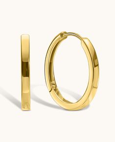 Our Solid Gold Huggie Earrings: timeless elegance in 14K gold. Comfortable and versatile, they elevate any look with understated charm. Classic 14k Gold Filled Hoop Earrings For Everyday Luxury, Refined 14k Gold Earrings For Formal Occasions, Minimalist Polished Earrings For Formal Occasions, Minimalist Polished Finish Earrings For Formal Occasions, Minimalist Polished Finish Formal Earrings, Classic Huggie Earrings As Gift, Minimalist 14k Gold Hoop Earrings With Shiny Finish, Classic Rose Gold Sterling Silver Huggie Earrings, 14k Gold Earrings With Timeless Design