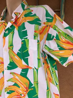 Oranges and green White background Bamboo Palm leaves Bananas Great fabric design Cotton Sturdy Buttons down front Fuller fit style Label: Club Med 2021156 Size: Mens Lg, approx Mens 44-some 46s. Check measurements against your bod and similar clothing. Condition: Excellent vintage. No issues of note. Freshly dry cleaned. See pics. Sold as is. Flat Measurements: Chest: 24.5inches (62.23cm) Shoulder, seam to seam: 19.5inches (49.53cm) Shoulder to hem length: 27inches (68.58cm) Waist: 25inches (63 Cheap Green Hawaiian Shirt With Button Closure, Affordable Orange Hawaiian Shirt For Summer, Affordable Yellow Hawaiian Shirt, Cheap Yellow Men's Hawaiian Shirt, Cheap Men's Yellow Hawaiian Shirt, Affordable Green Hawaiian Shirt For Beach Season, Cheap Retro Cotton Hawaiian Shirt, Cheap Yellow Hawaiian Shirt For Men, Luxury Cotton Hawaiian Shirt With Camp Collar