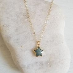 When you wish upon a star.......The cutest everyday necklace when you just want to add a bit of sparkle.A tiny star framed in gold in your choice of Moonstone or Aquamarine is suspended from shimmering Gold Filled chain.Wear it by itself for a minimalist look or easily layer it with other favorites.Details:* A genuine Moonstone or Aquamarine Star Size: 10 to 12 mm* Genuine Gold Filled Chain & Components (Not plated)* Timeless Style. Perfect for Layering* Great Gift IdeaMatching Earrings---&g Wish Upon A Star, Tiny Star, Everyday Necklace, Gold Filled Chain, Star Necklace, Timeless Style, Aquamarine, The Cutest, Moonstone