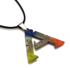 two necklaces that have different shapes and colors on them, one is shaped like an arrow