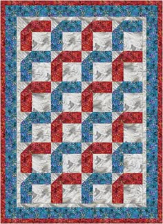 a red, white and blue quilt on display