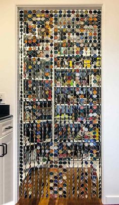 the door is made out of hundreds of pairs of shoes and ties on display in front of an oven