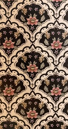 an ornate wallpaper with flowers and leaves on black, white, and pink colors