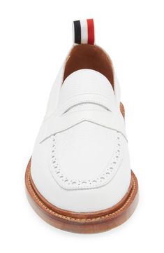 A tricolor grosgrain pull loop brings the label's signature flair to this calfskin-leather loafer detailed with classic broguing at the apron toe. Leather upper and lining/leather and synthetic sole Made in the UK Designer Shoes White Tassel Loafers With Rubber Sole For Formal Occasions, White Tassel Loafers With Leather Sole For Business, White Tassel Loafers With Brogue Detailing For Formal Occasions, White Tassel Loafers For Business, White Calf Leather Loafers For Work, White Oxfords With Brogue Detailing For Work, White Brogue Oxfords For Work, White Leather Tassel Loafers For Business, White Cap Toe Leather Shoes For Work